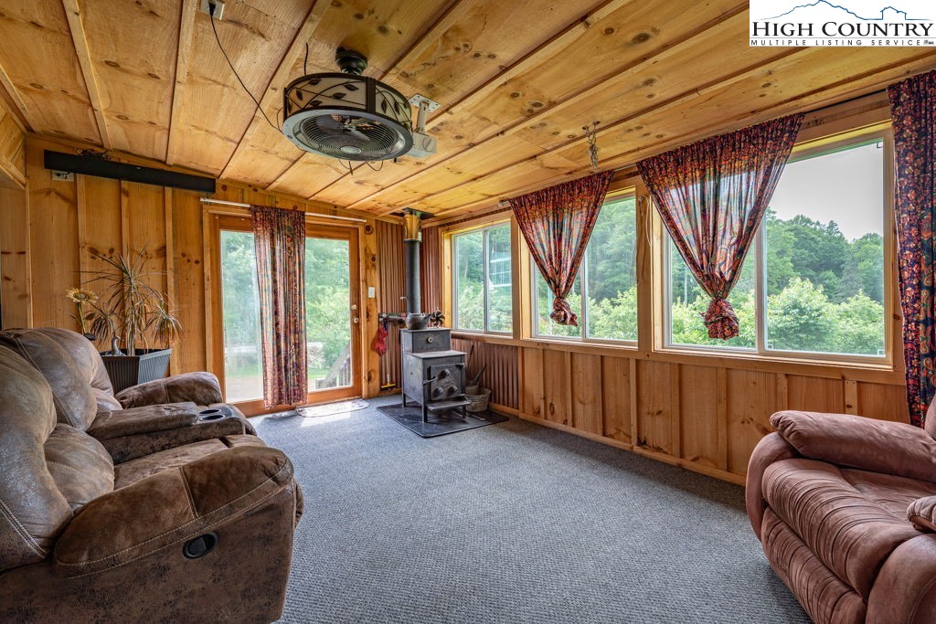 285 Roaring Fork Road Todd, NC 28684 - Photo 33 of 41 a living room with furniture and a large window