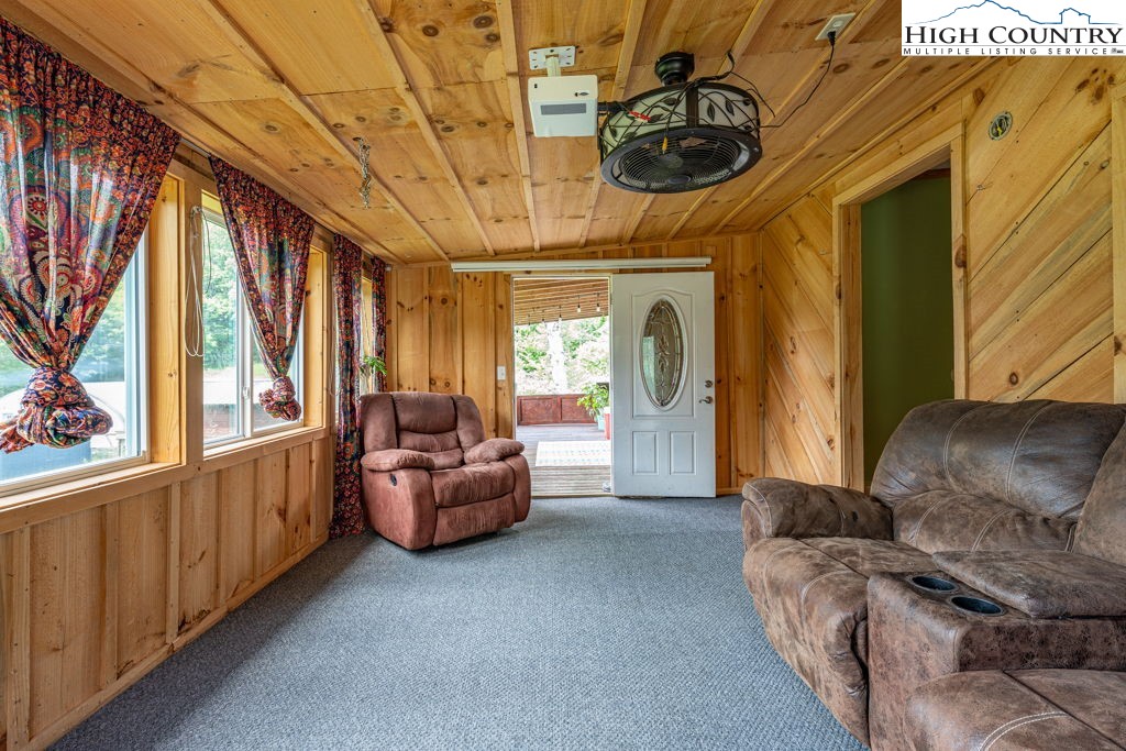 285 Roaring Fork Road Todd, NC 28684 - Photo 34 of 41 a living room with furniture and a large window