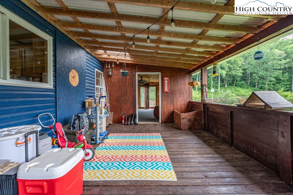 285 Roaring Fork Road Todd, NC 28684 - Photo 36 of 41 a front view of a house with a patio