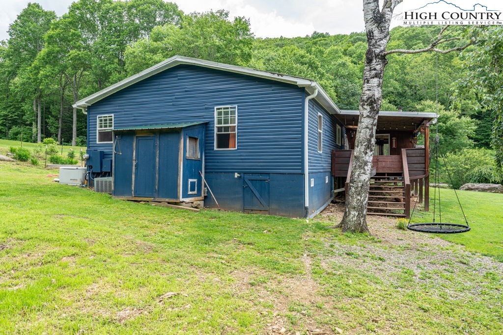 285 Roaring Fork Road Todd, NC 28684 - Photo 4 of 41 a view of a backyard of the house