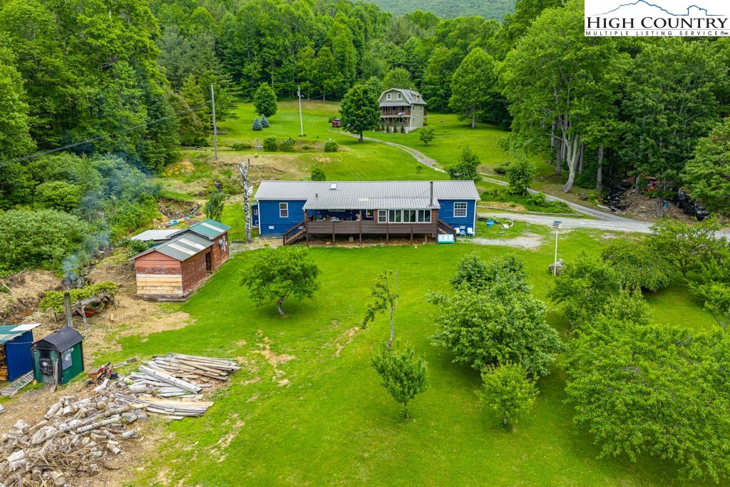 285 Roaring Fork Road Todd, NC 28684 - Photo 6 of 41 an aerial view of residential houses with outdoor space and trees all around