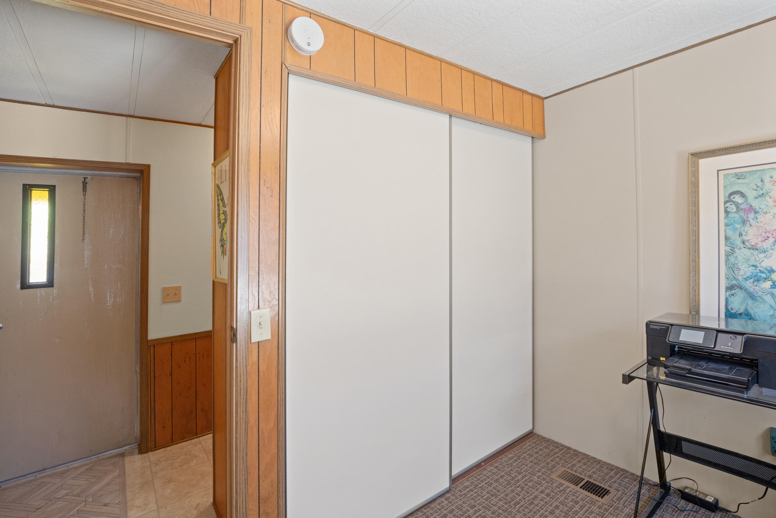 5076 Leonard Road, Unit 97 Grants Pass, OR 97527 - Photo 20 of 36 Large closet. Note back/side yard door to porch.