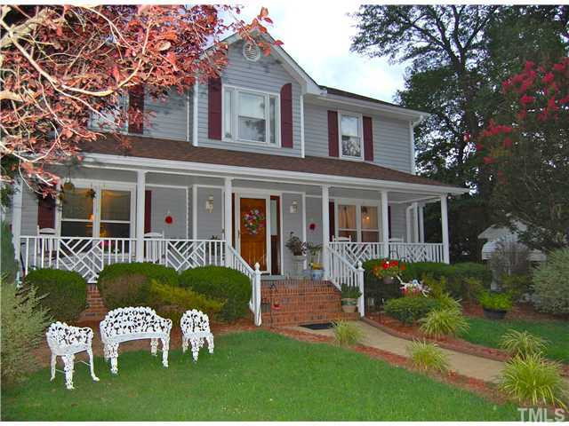 628 Junction Road Durham, NC 27703 - Photo 1 of 3 a front view of a house with a yard table and chairs