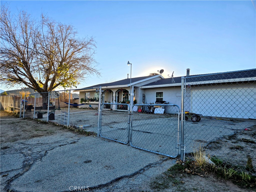 40525 166th Street East Lancaster, CA 93535 - Photo 16 of 30 a view of a house with a backyard