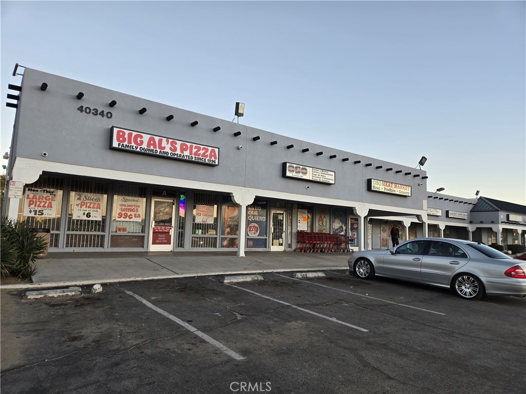 40525 166th Street East Lancaster, CA 93535 - Photo 25 of 30 a view of a cars parked in front of a building