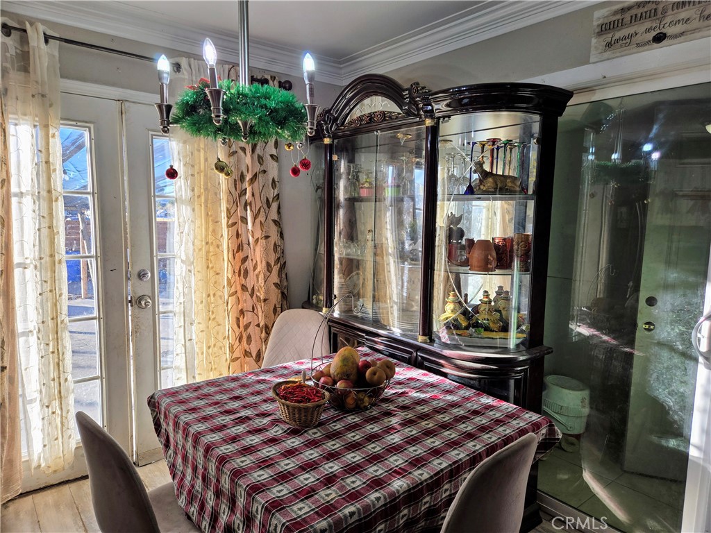 40525 166th Street East Lancaster, CA 93535 - Photo 6 of 30 a living room with furniture and a potted plant