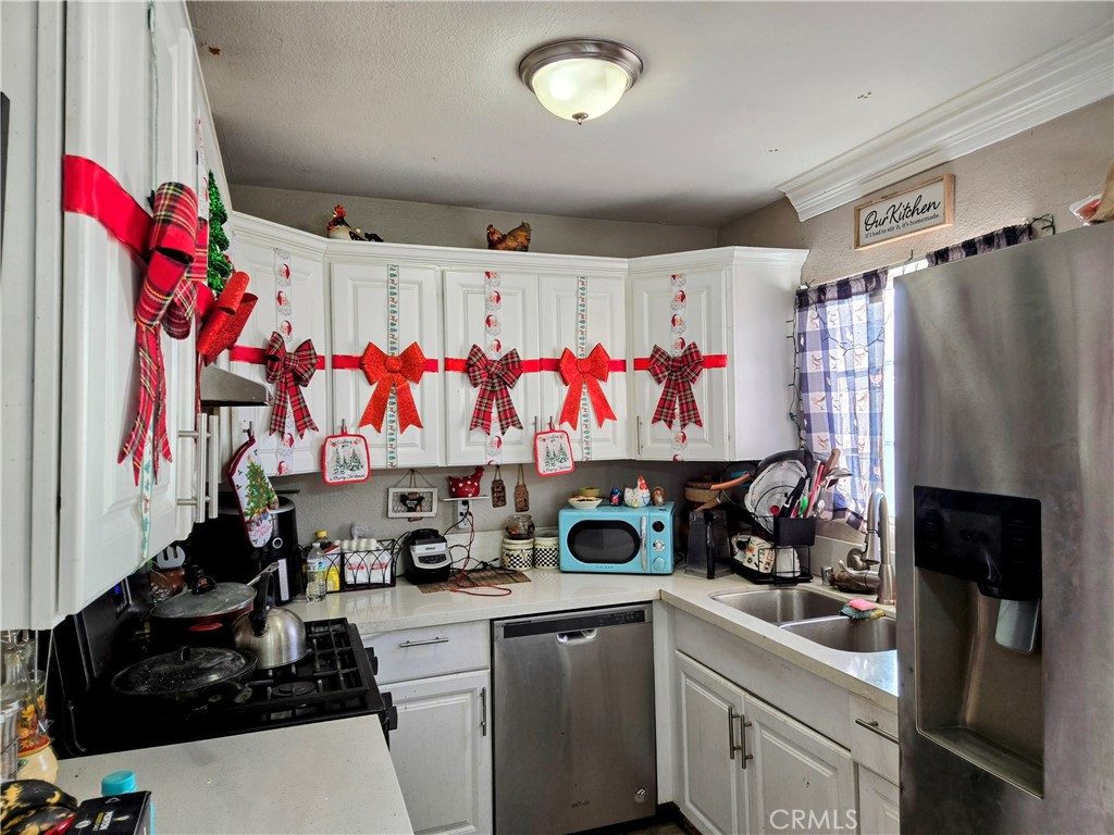 40525 166th Street East Lancaster, CA 93535 - Photo 7 of 30 a view of a kitchen with sink and cabinets