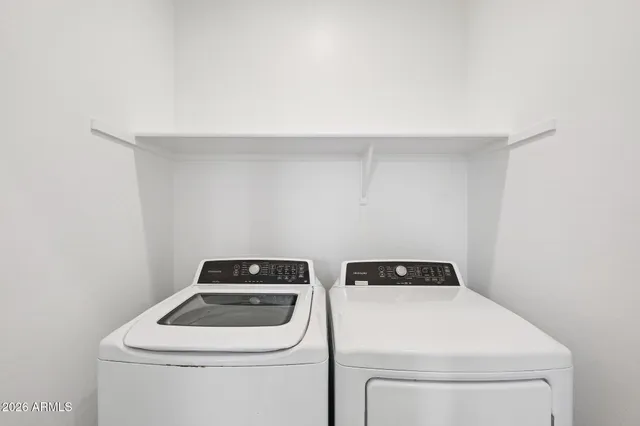 a utility room with dryer and washer