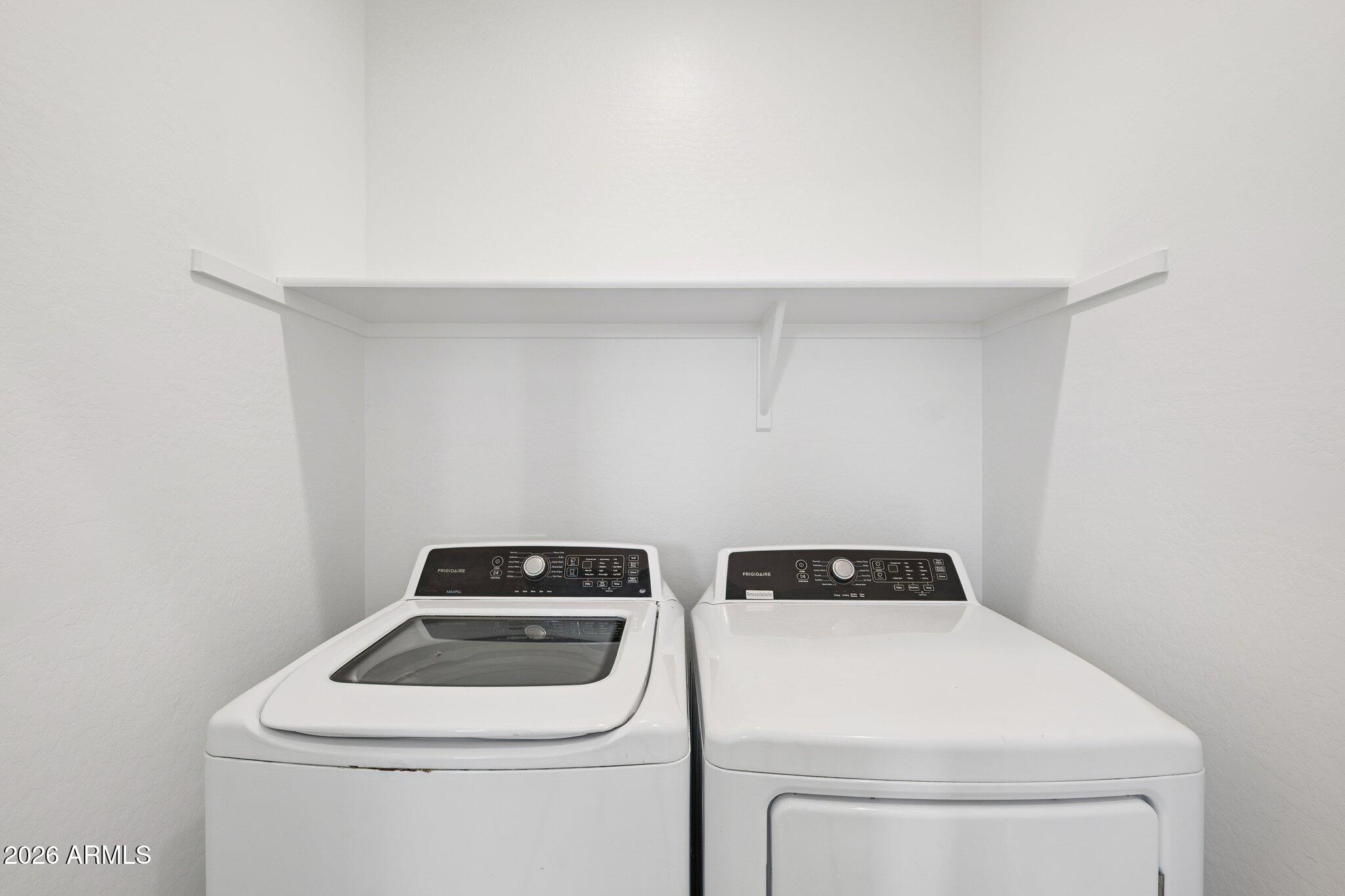 4313 West Allen Street Laveen, AZ 85339 - Photo 15 of 22 a utility room with dryer and washer