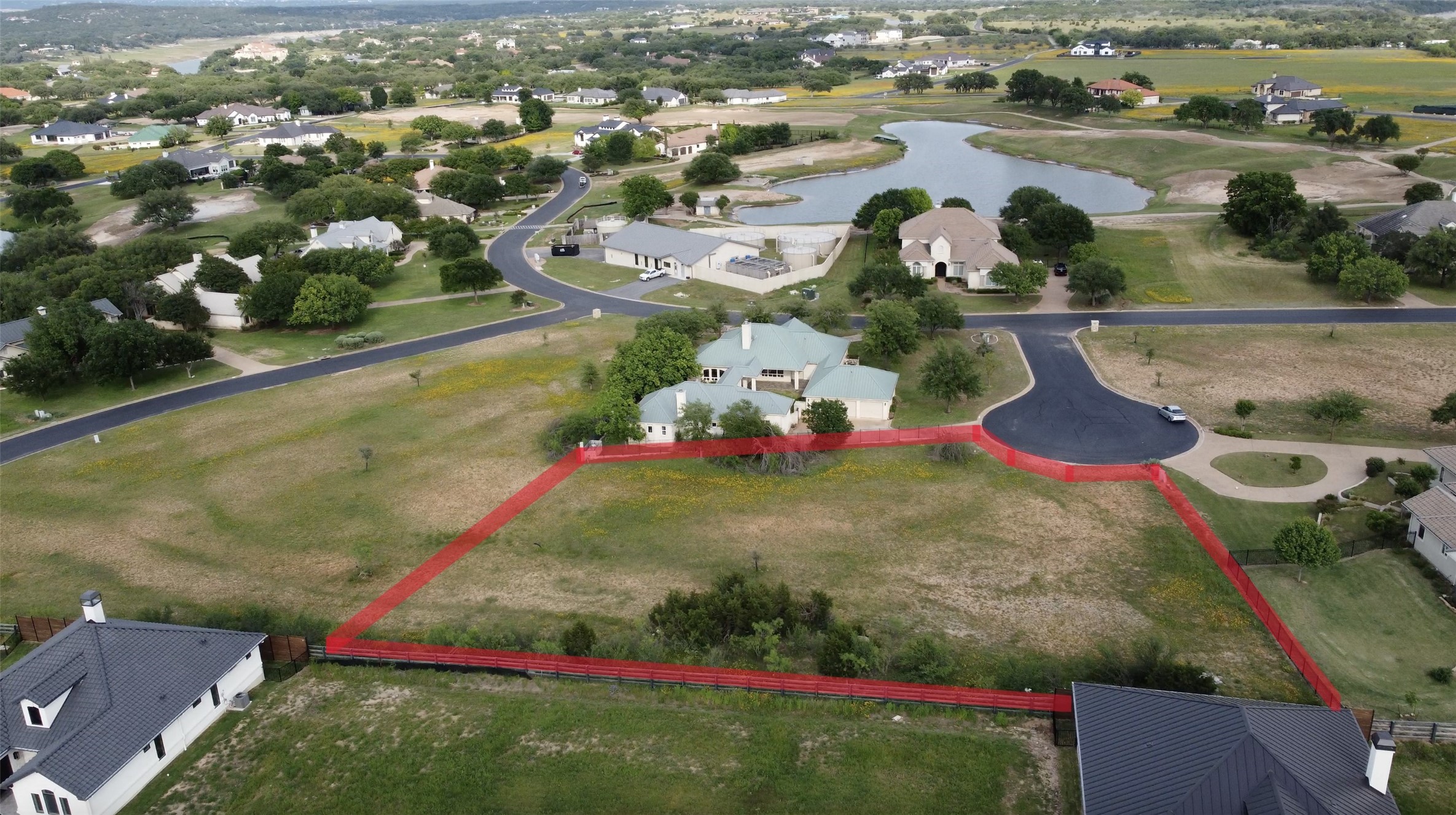 26604 Hunters Grove Court Spicewood, TX 78669 - Photo 1 of 8 an aerial view of residential houses with outdoor space