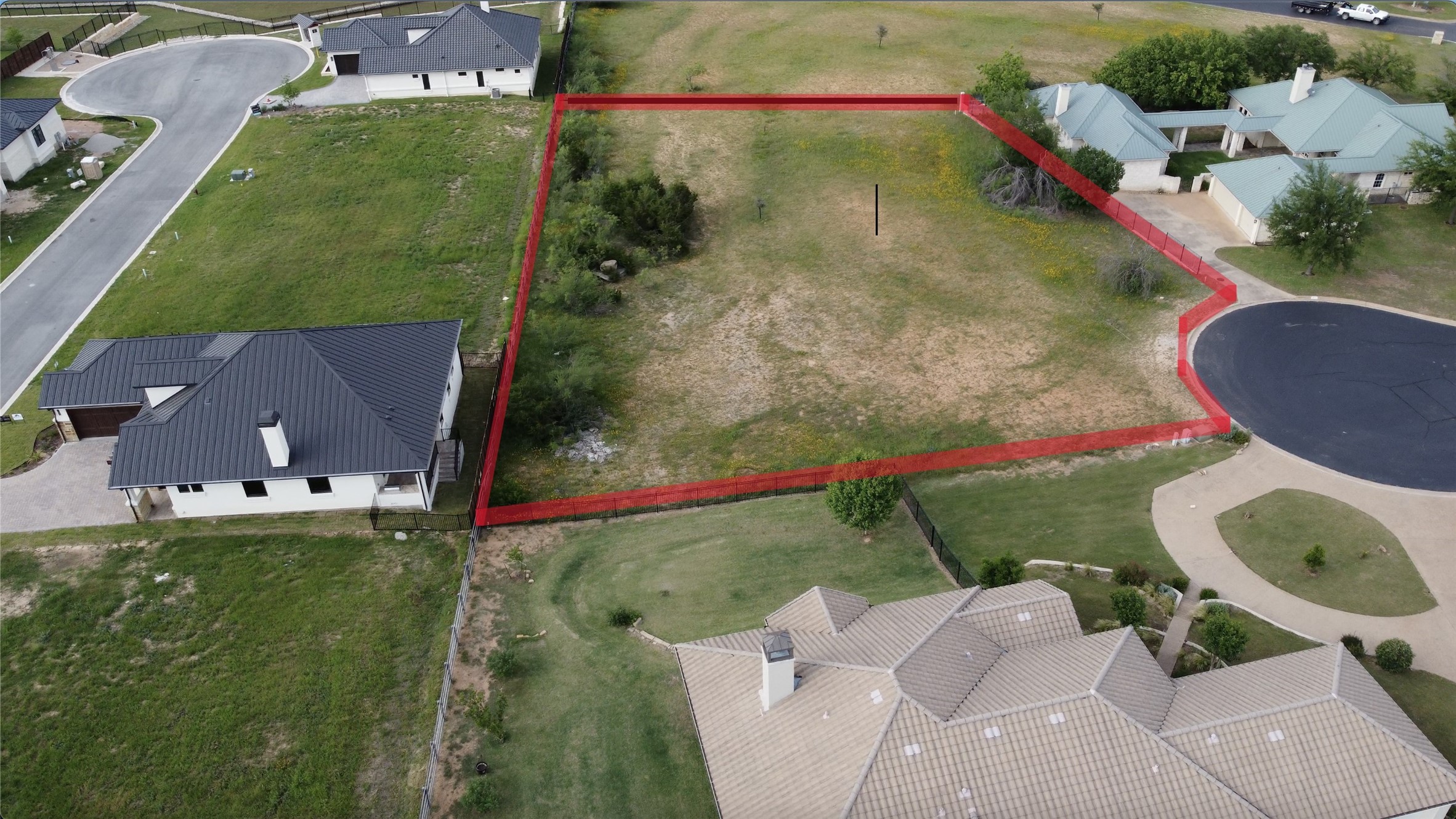 26604 Hunters Grove Court Spicewood, TX 78669 - Photo 3 of 8 an aerial view of a house with a yard and lake view