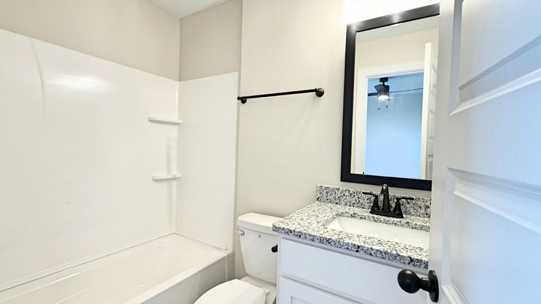 305 Pollard Road Clarksville, TN 37042 - Photo 13 of 14 a bathroom with a granite countertop sink a toilet and shower