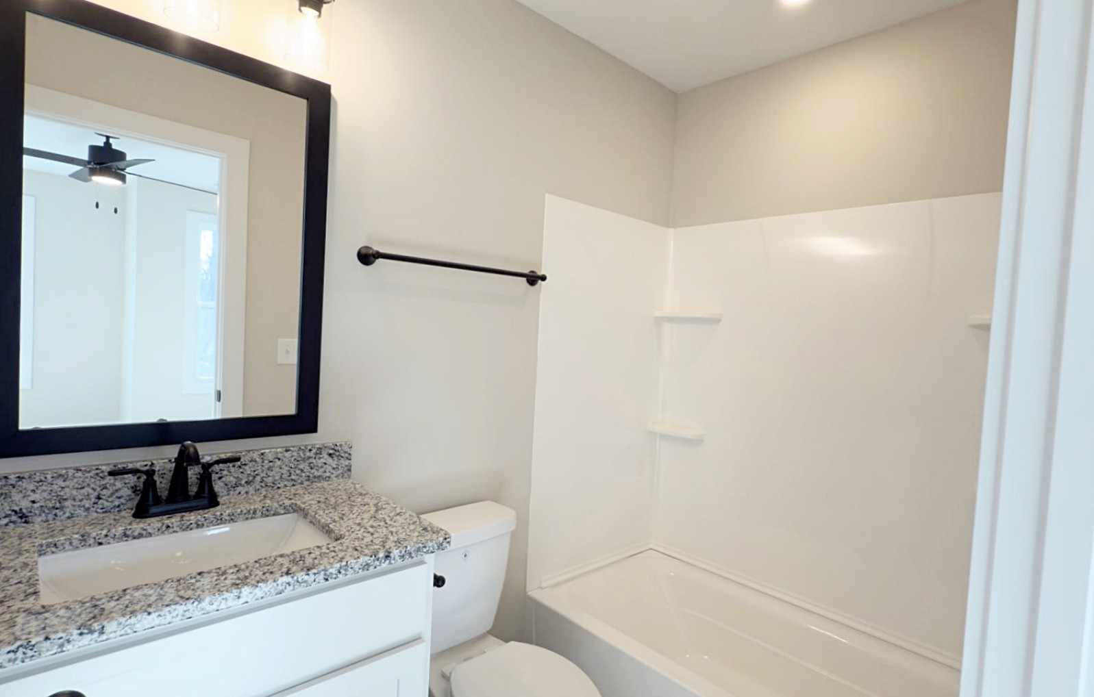 305 Pollard Road Clarksville, TN 37042 - Photo 10 of 14 a bathroom with a granite countertop sink and a mirror