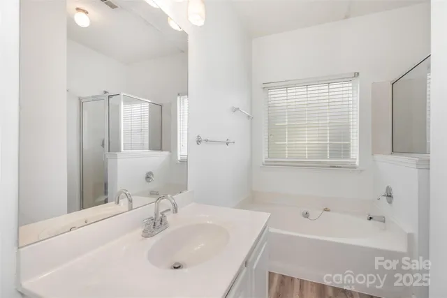 a bathroom with a bathtub and a sink