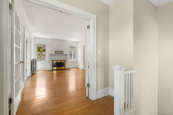 a view of living room with furniture and fireplace