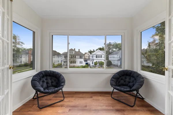 a living room with furniture and a large window