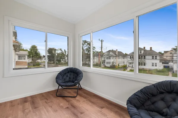 a living room with couch and a large window