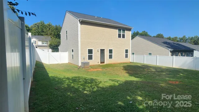 a view of a back yard of the house