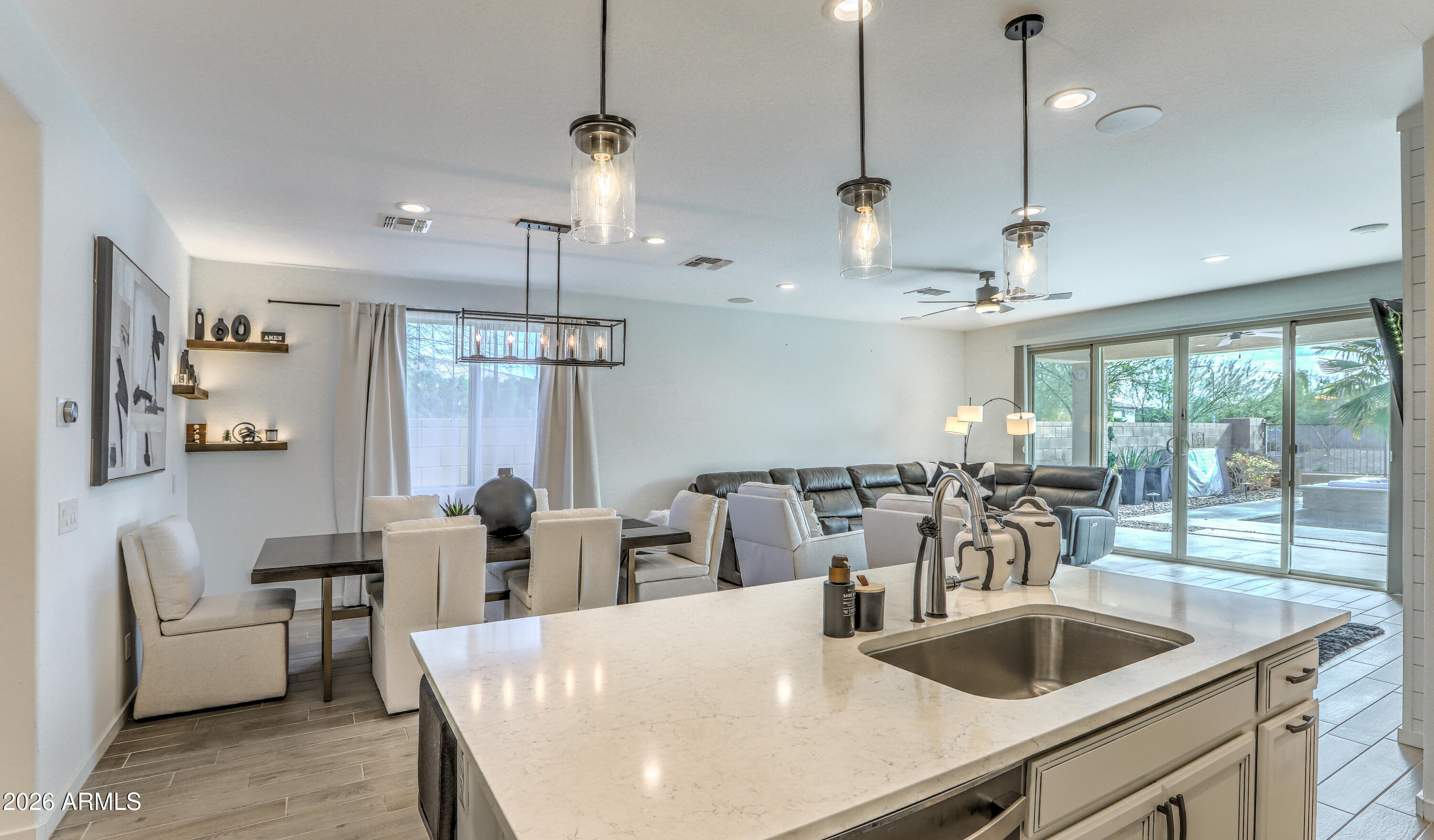 7727 West Agora Lane Phoenix, AZ 85043 - Photo 13 of 46 a large kitchen with a table and chairs