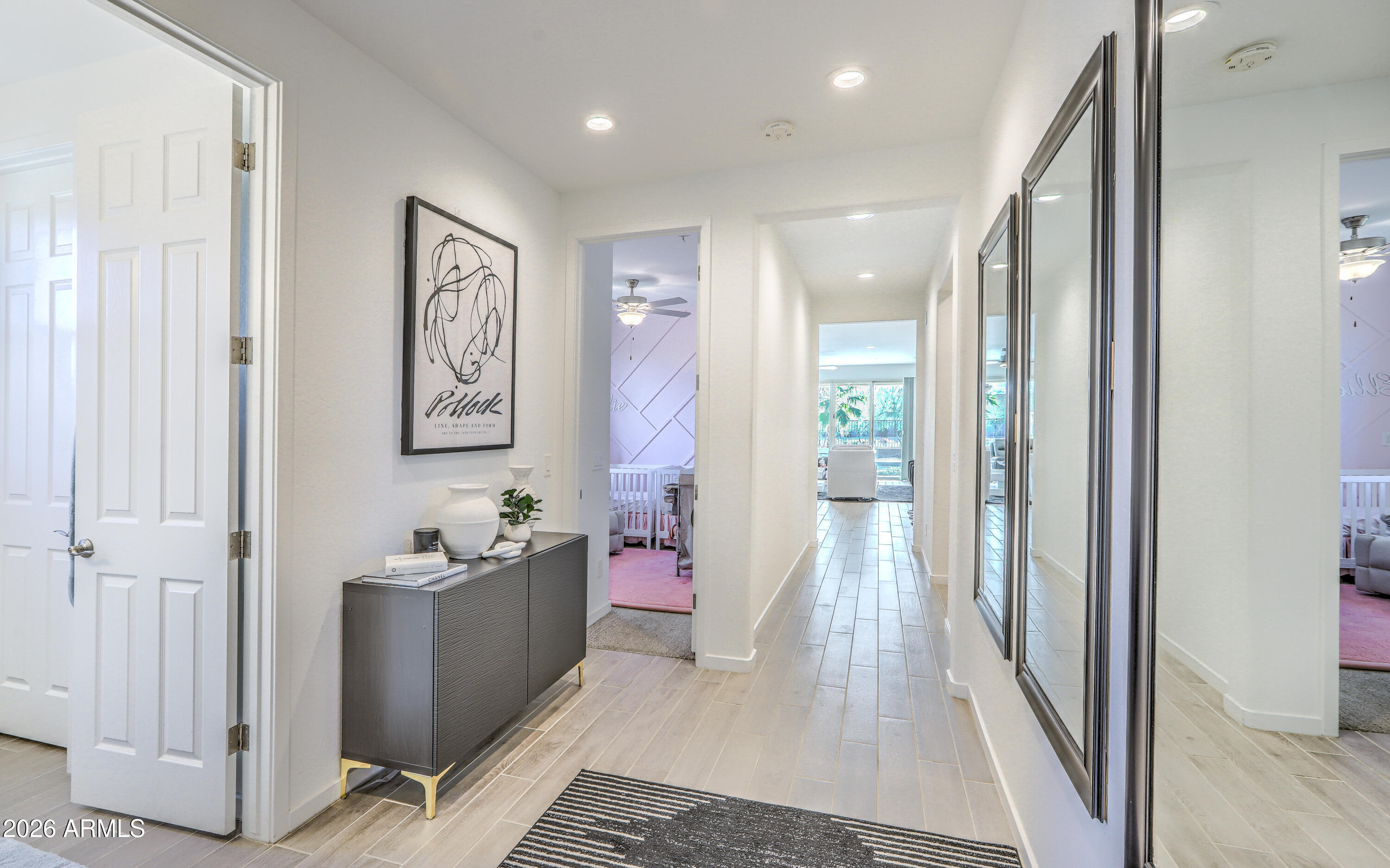 7727 West Agora Lane Phoenix, AZ 85043 - Photo 22 of 46 a very nice looking room with a wooden floor and a bathroom