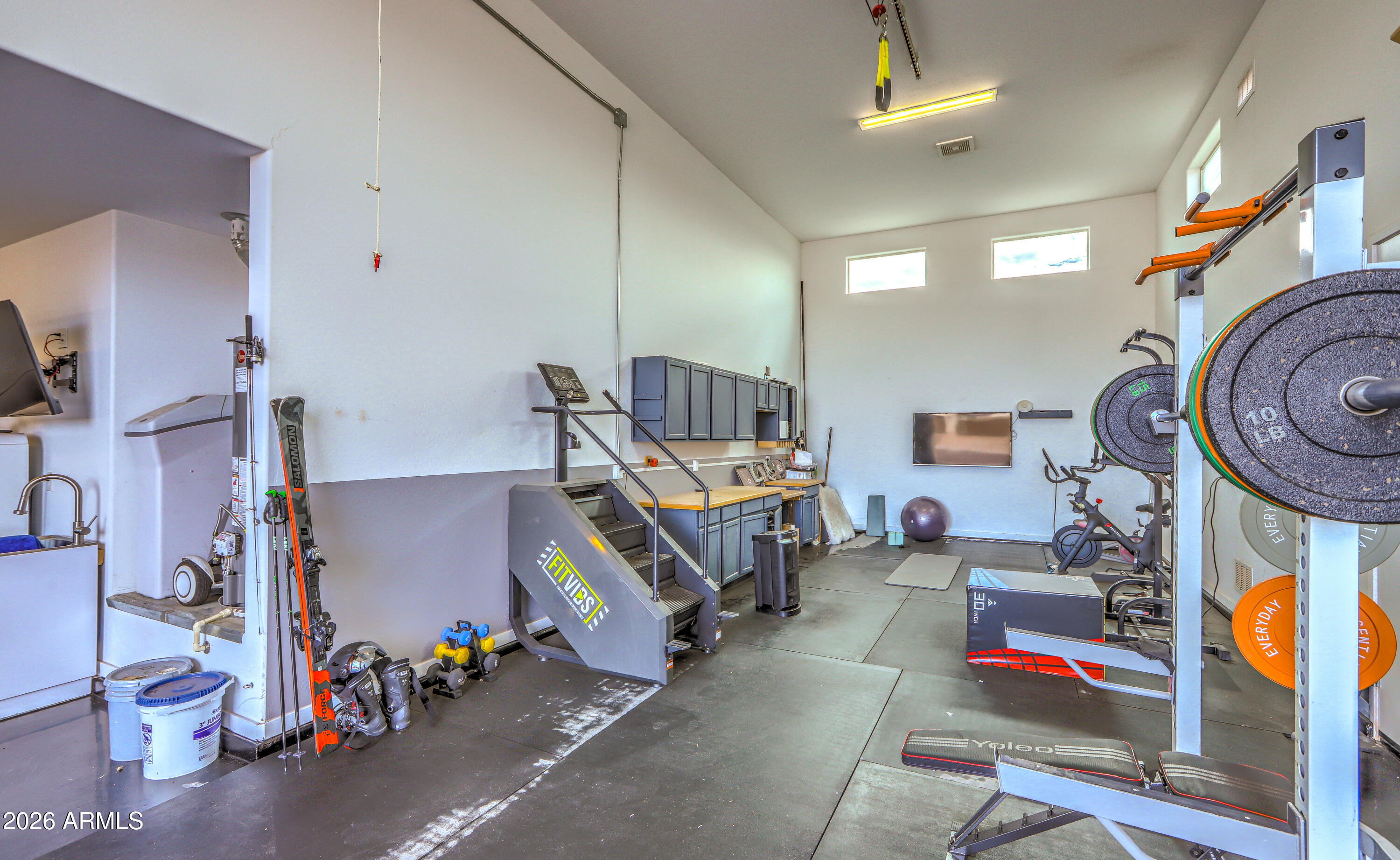 7727 West Agora Lane Phoenix, AZ 85043 - Photo 32 of 46 a room with musical instruments and air hockey table