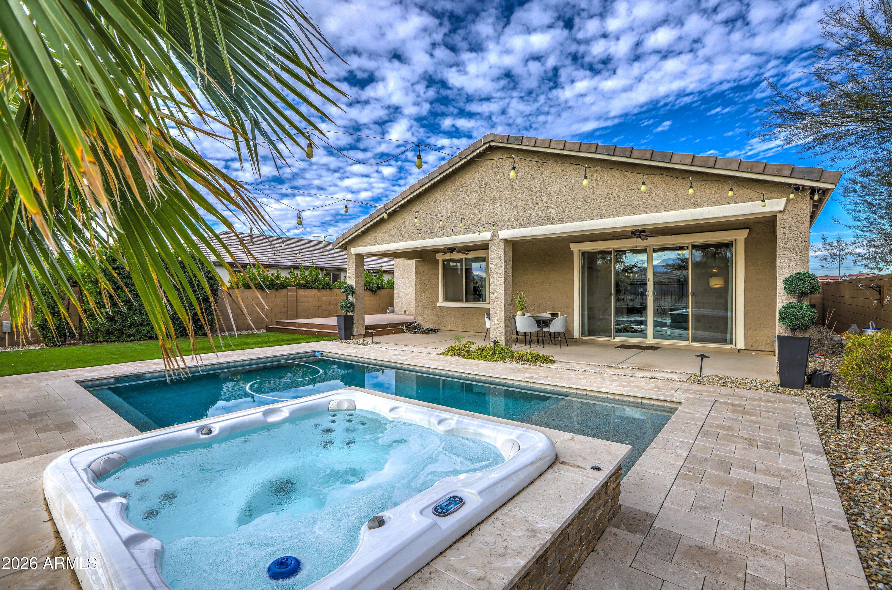 7727 West Agora Lane Phoenix, AZ 85043 - Photo 35 of 46 a view of a house with a swimming pool and sitting area