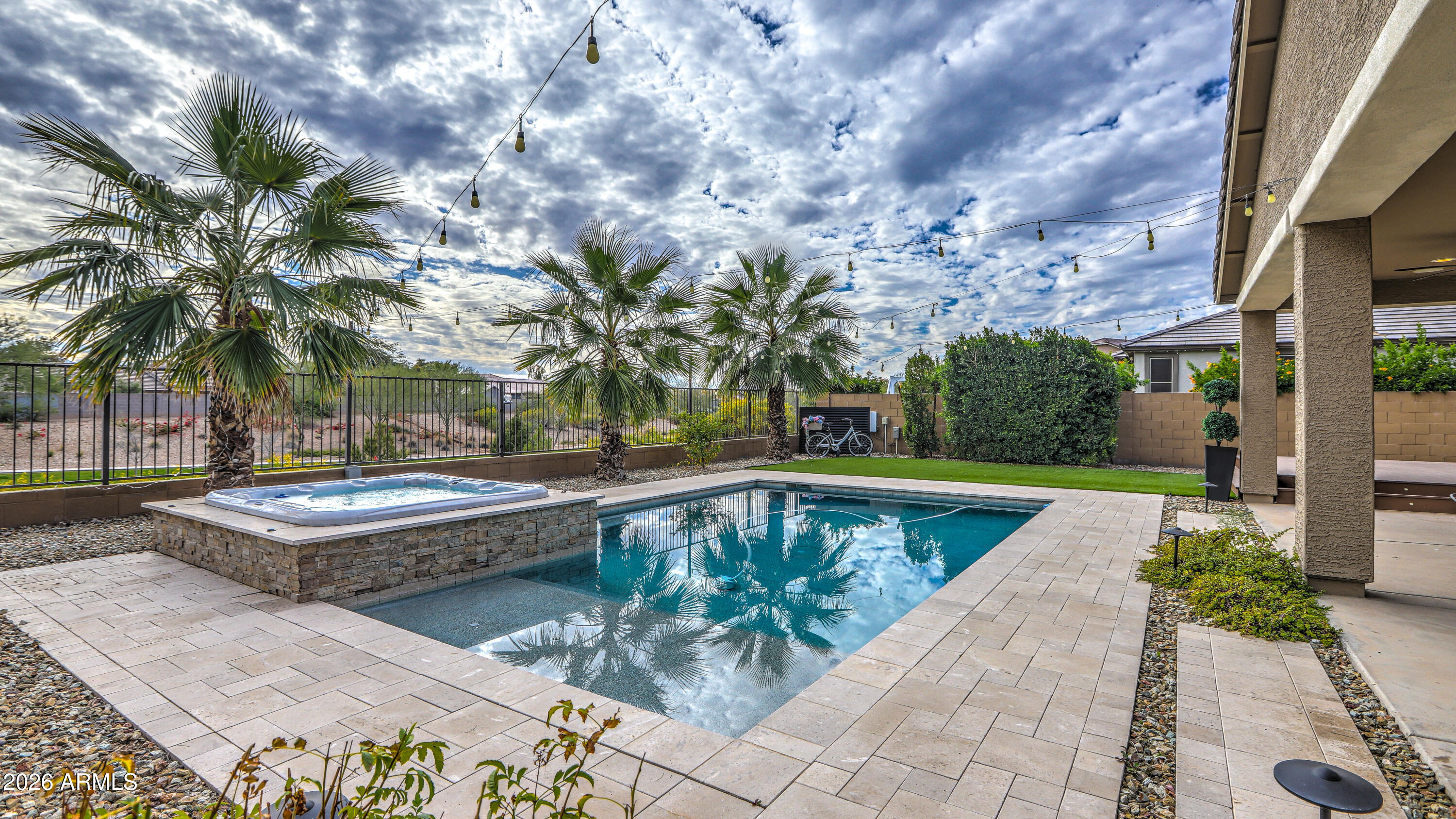 7727 West Agora Lane Phoenix, AZ 85043 - Photo 36 of 46 a view of a swimming pool with a patio