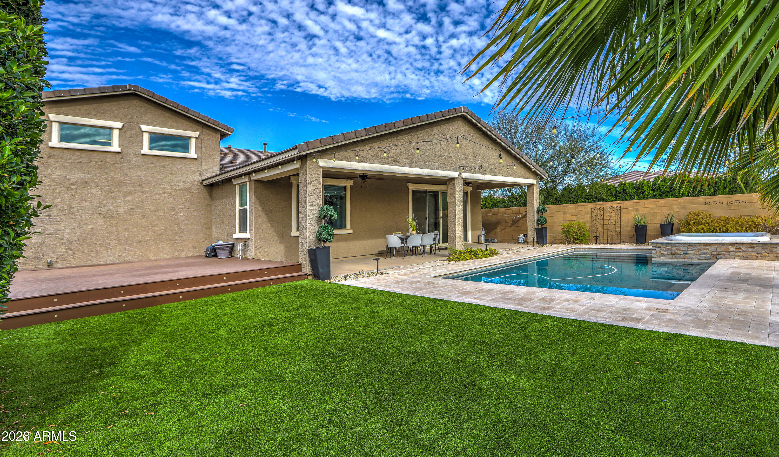 7727 West Agora Lane Phoenix, AZ 85043 - Photo 37 of 46 a view of a house with a yard porch and sitting area