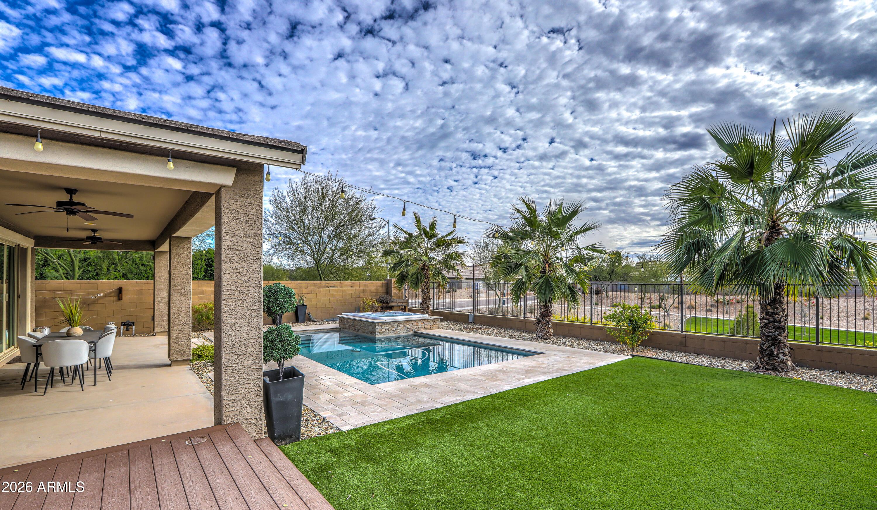 7727 West Agora Lane Phoenix, AZ 85043 - Photo 39 of 46 a swimming pool with outdoor seating and yard