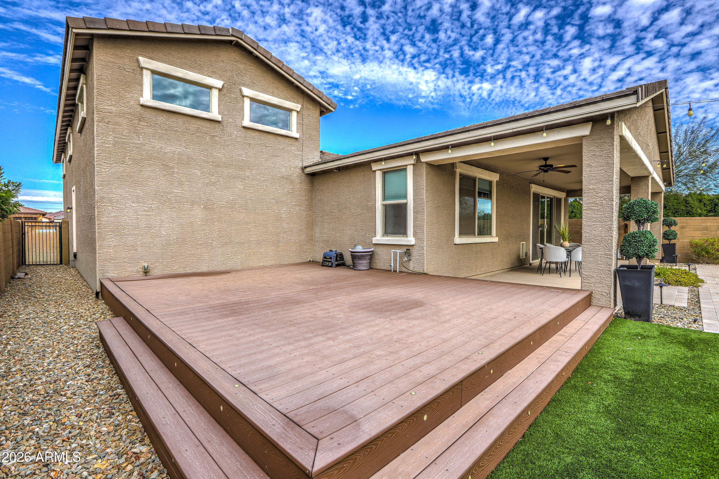 7727 West Agora Lane Phoenix, AZ 85043 - Photo 43 of 46 a front view of a house with garden