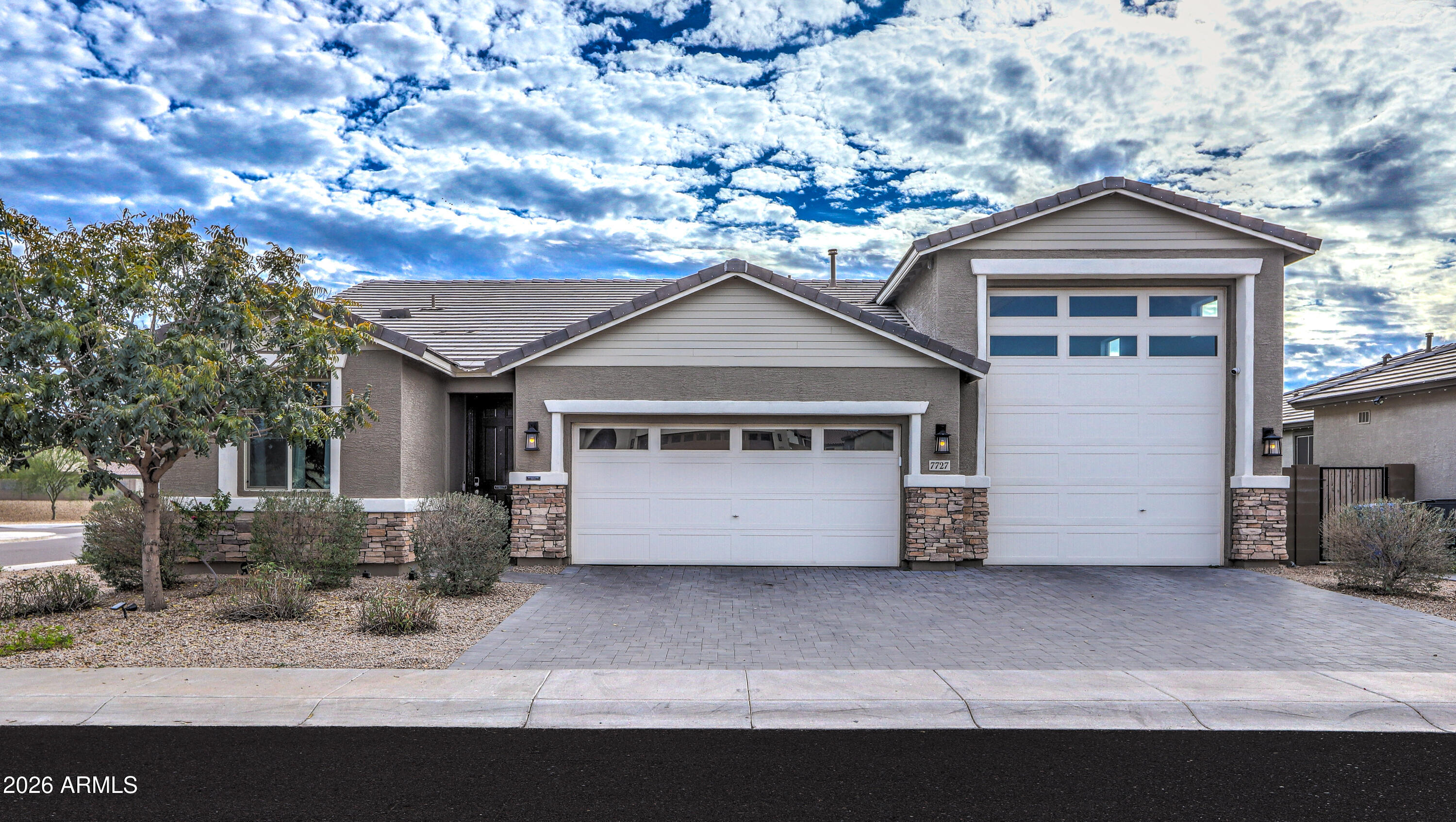 7727 West Agora Lane Phoenix, AZ 85043 - Photo 45 of 46 a front view of a house with a yard