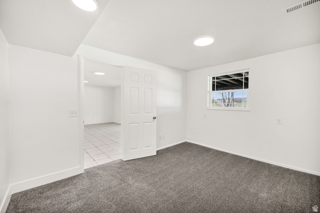 4155 Johnson Road Nibley, UT 84321 - Photo 43 of 71 Empty room featuring dark colored carpet and baseboards