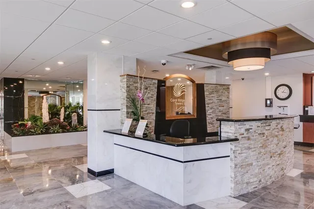 a kitchen with stainless steel appliances granite countertop a stove and a refrigerator