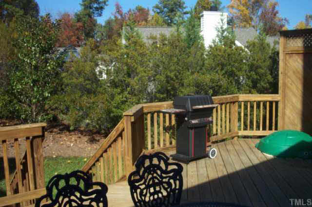 4212 Norman Ridge Lane Raleigh, NC 27613 - Photo 5 of 7 a view of a deck with chairs and wooden floor