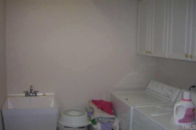 4212 Norman Ridge Lane Raleigh, NC 27613 - Photo 6 of 7 a bathroom with a sink toilet and vanity