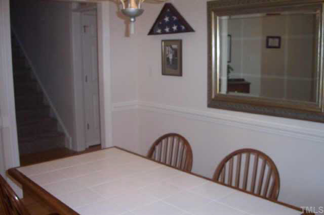 4212 Norman Ridge Lane Raleigh, NC 27613 - Photo 7 of 7 a view of wooden floor and dining room