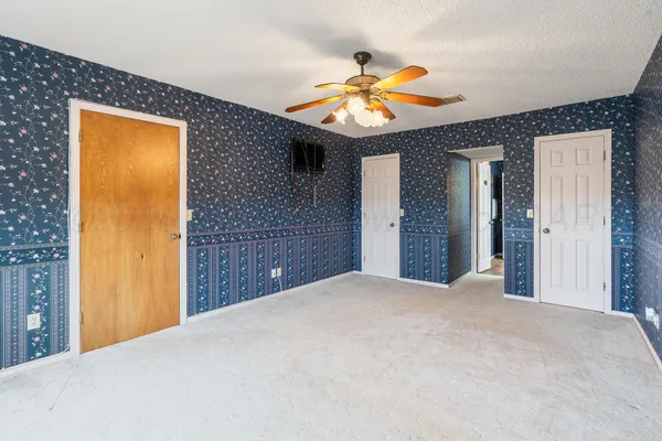 a view of a hallway with a chandelier