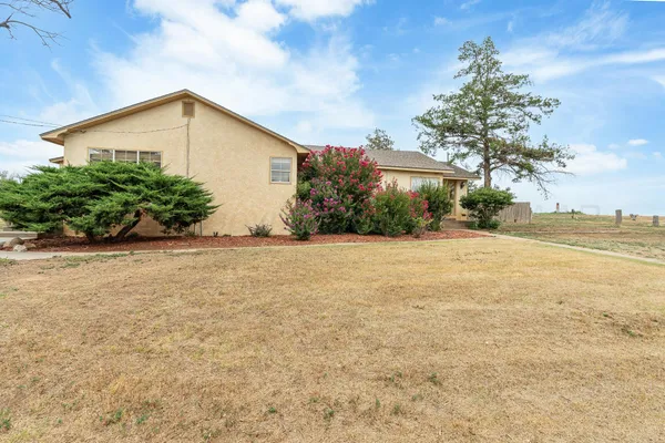 a view of a backyard of the house