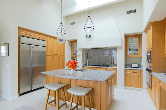 a view of a dining room with a table and chairs