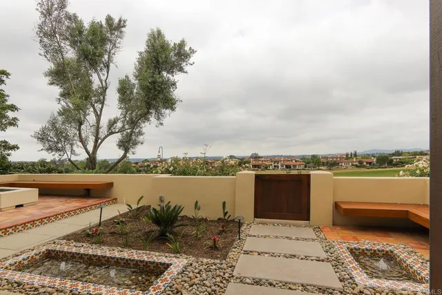 a view of a terrace with outdoor seating and trees