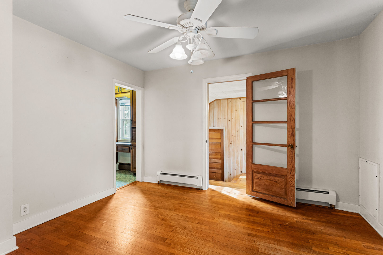 400 East 3rd Street Brocton, IL 61917 - Photo 17 of 54 an empty room with wooden floor closet and windows