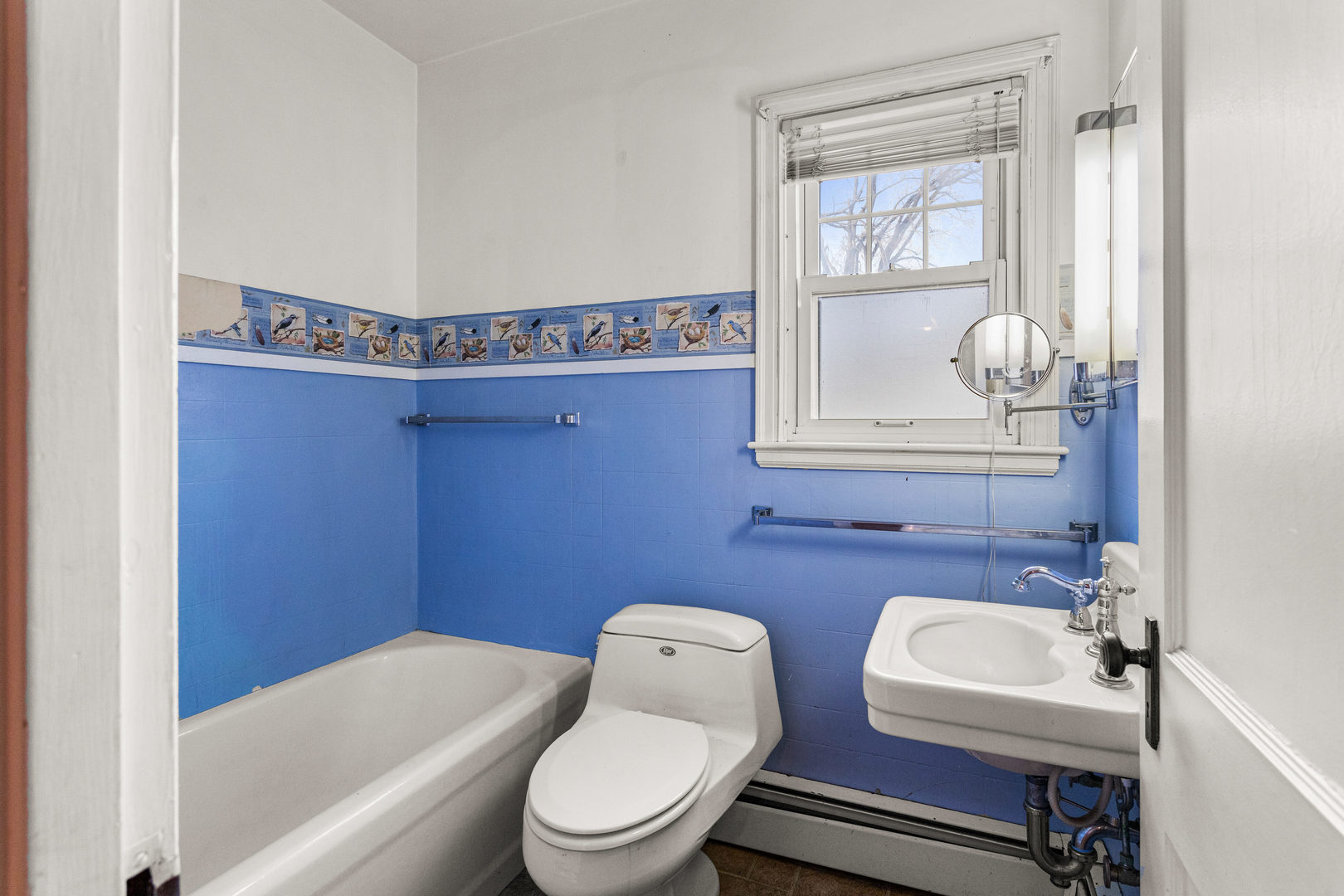 400 East 3rd Street Brocton, IL 61917 - Photo 19 of 54 a bathroom with a toilet a sink and mirror