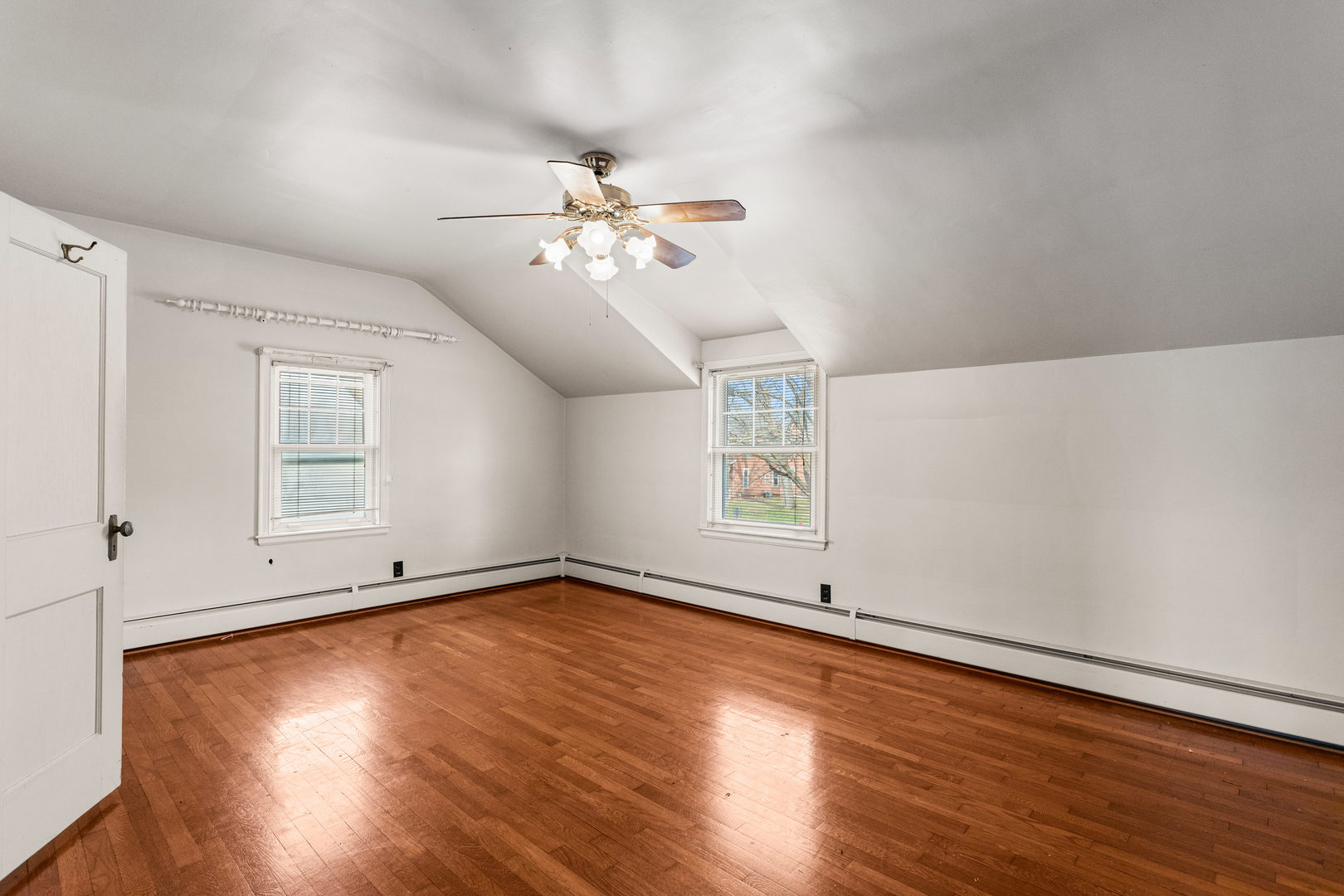 400 East 3rd Street Brocton, IL 61917 - Photo 22 of 54 a view of empty room with wooden floor and fan