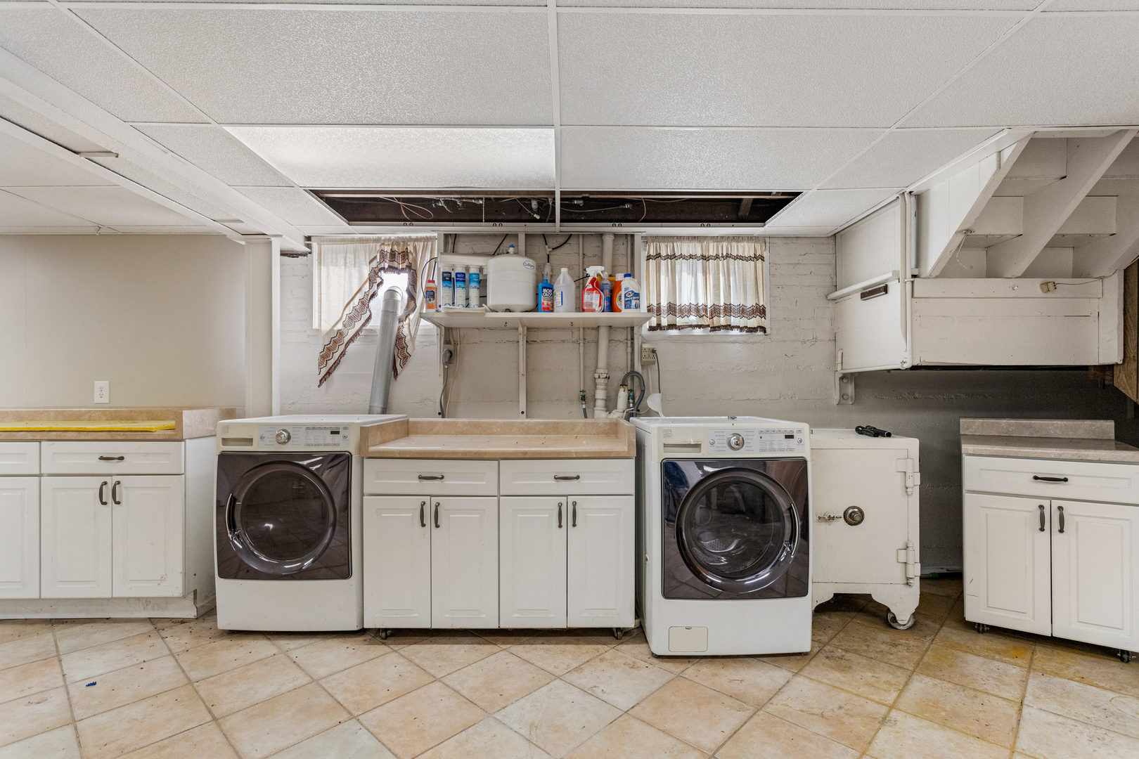 400 East 3rd Street Brocton, IL 61917 - Photo 30 of 54 a utility room with cabinets dryer and washer