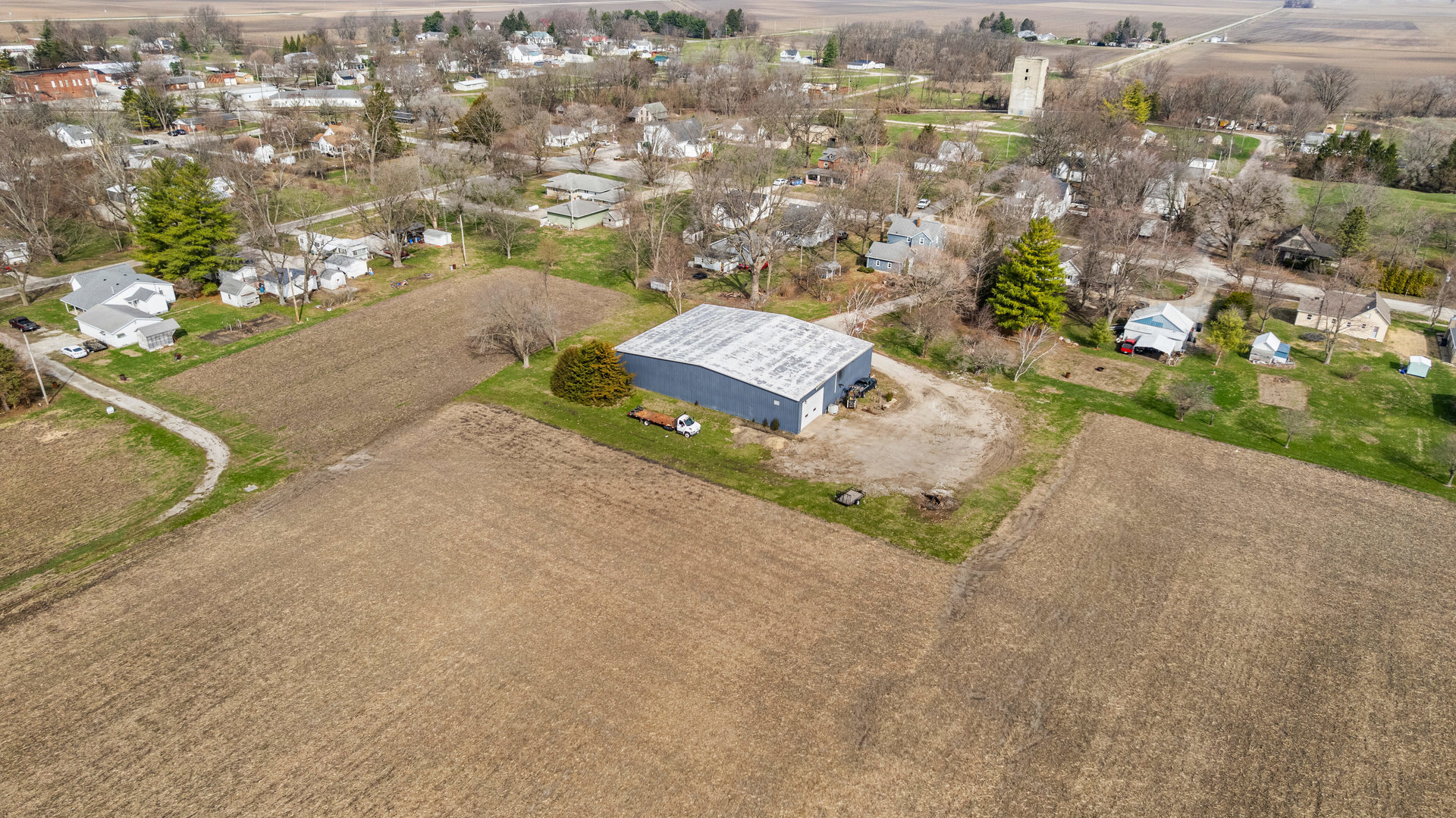 400 East 3rd Street Brocton, IL 61917 - Photo 49 of 54 an aerial view of a house with a yard and mountain view in back