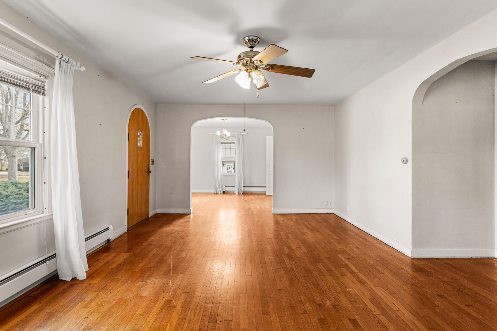400 East 3rd Street Brocton, IL 61917 - Photo 10 of 54 a view of empty room with wooden floor and fan