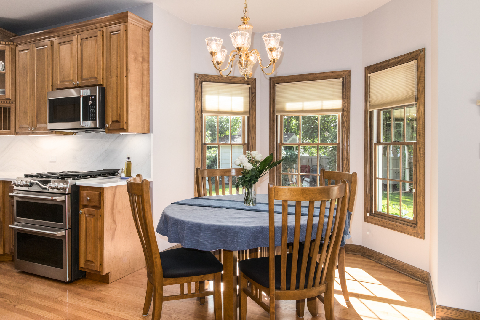 408 North Seminary Avenue Park Ridge, IL 60068 - Photo 13 of 26 a dining room with furniture a window and wooden floor