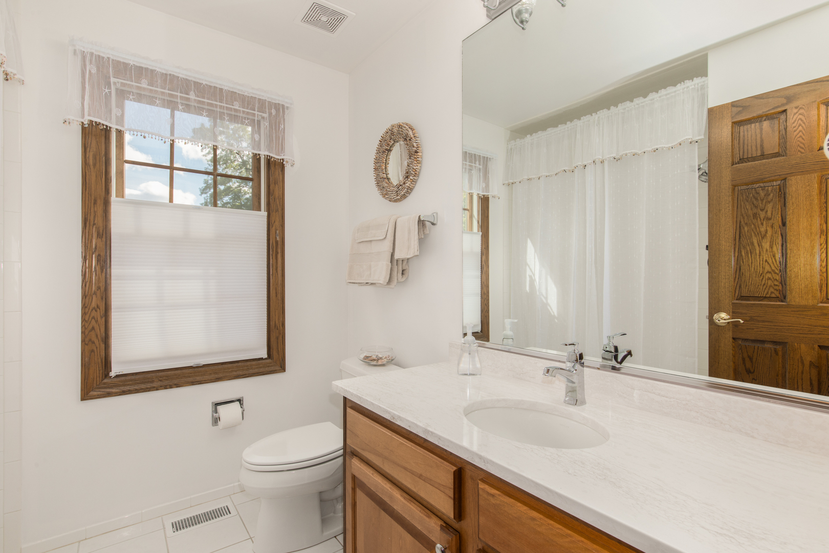408 North Seminary Avenue Park Ridge, IL 60068 - Photo 21 of 26 a bathroom with a granite countertop sink mirror vanity and toilet