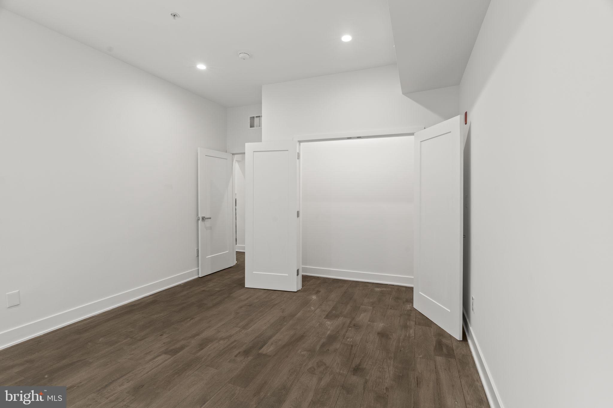 1244 South 20th Street, Unit 2 Philadelphia, PA 19146 - Photo 18 of 30 an empty room with wooden floor