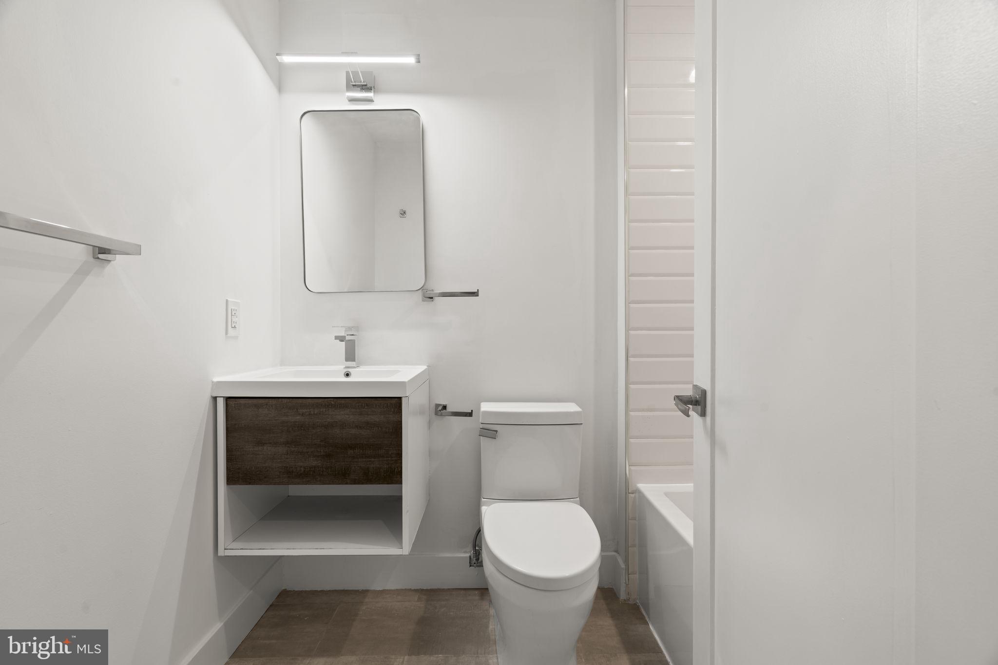1244 South 20th Street, Unit 2 Philadelphia, PA 19146 - Photo 19 of 30 a bathroom with a sink and a toilet